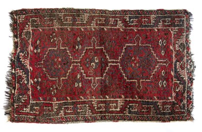 Lot 178 - Red ground rug Afghanistan, with three central...