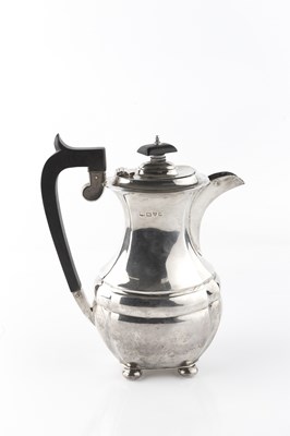 Lot 561 - A silver hot water pot, with shaped body and...