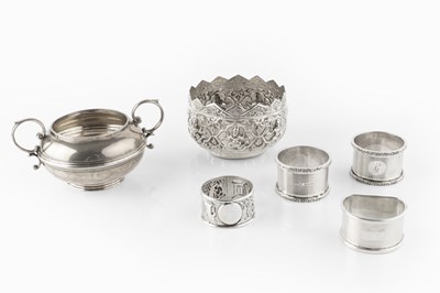 Lot 563 - A Burmese silver bowl, embossed with panels of...