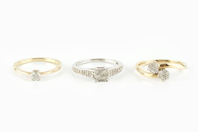 Lot 134 - Three diamond set dress rings, comprising a...