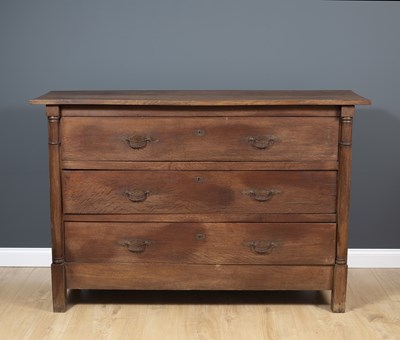 Lot 137 - A 19th century French oak three drawer commode,...