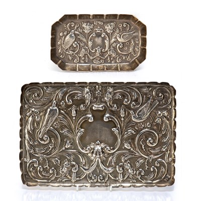 Lot 439 - Two silver dressing table trays with repousse...