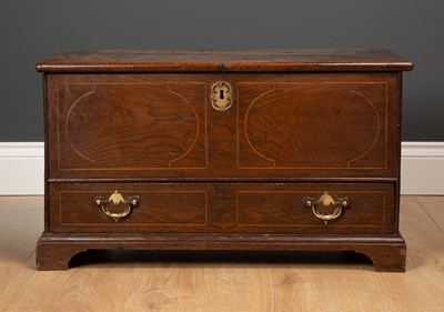 Lot 371 - A small elm chest with a lifting lid and...