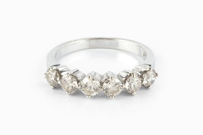 Lot 150 - A diamond half hoop ring, the round...