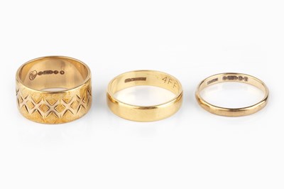 Lot 124 - Three wedding bands, comprising an 18ct gold...