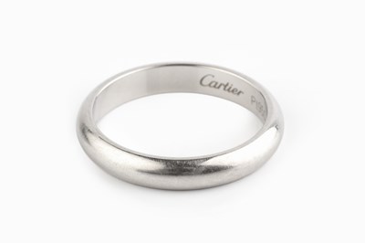 Lot 176 - A platinum wedding band by Cartier, of...