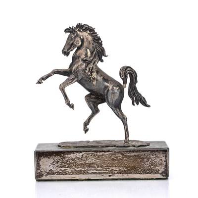 Lot 436 - White metal and silver model of a rearing...