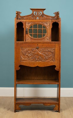 Lot 160 - An Arts and Crafts bureau cabinet, circa 1910,...