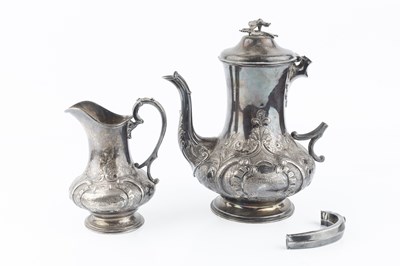 Lot 606 - A mid Victorian silver teapot, and matching...