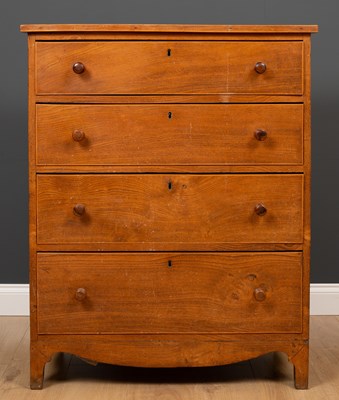 Lot 141 - An early 19th century elm chest of four long...