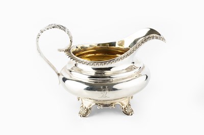 Lot 576 - A George IV silver milk jug, with gadrooned...