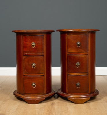 Lot 519 - A pair of modern hardwood cylindrical bedside...