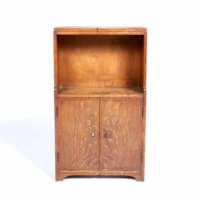 Lot 26 - In the manner of Heals small oak cupboard,...