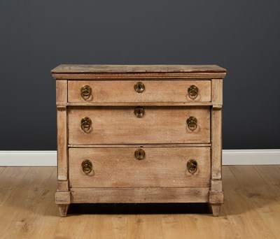 Lot 384 - A limed oak chest of three long graduated...