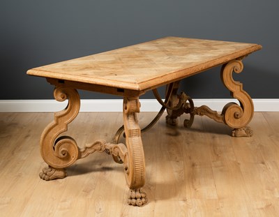 Lot 385 - A continental oak dining table with parquetry...