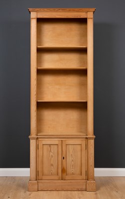 Lot 391 - A modern pine library bookcase with four...