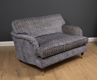 Lot 6 - A small modern deep two seater sofa with...