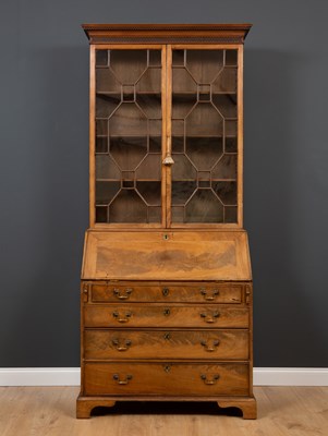 Lot 14 - A George III mahogany bureau bookcase with...