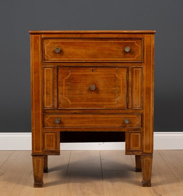 Lot 18 - A continental mahogany bedside cabinet with...