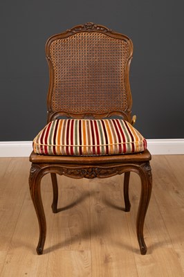 Lot 19 - A French walnut side chair with carved frame,...