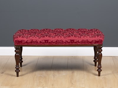 Lot 22 - A mahogany stool with turned tapering legs and...