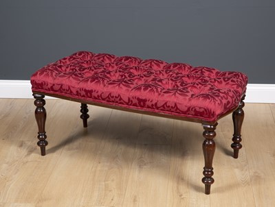 Lot 22 - A mahogany stool with turned tapering legs and...