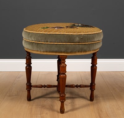 Lot 33 - A Victorian walnut circular dressing table...