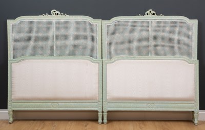 Lot 38 - A pair of green painted single beds with caned...