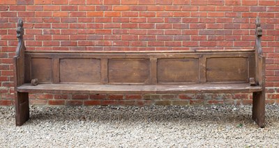 Lot 805 - A Victorian pine pew with carved finials to...