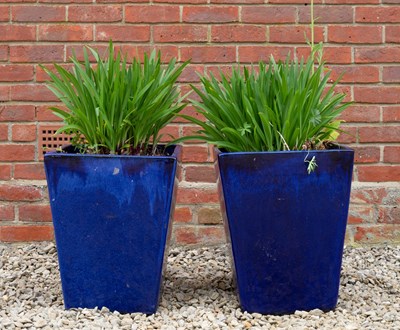 Lot 750 - A pair of blue glazed square section tapering...