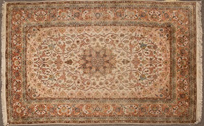 Lot 96 - A Kashmiri cream ground rug with stylized...