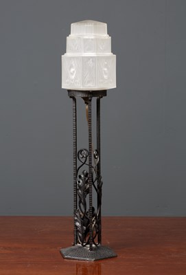 Lot 205 - A wrought iron table lamp with oak leaf...