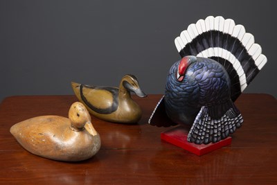 Lot 277 - An old striped pine decoy duck with glass eyes,...