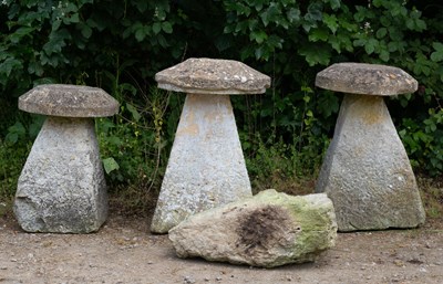 Lot 760 - A group of three carved staddle stones with...