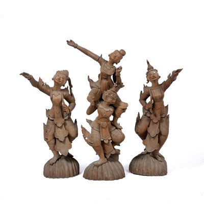 Lot 412 - A group of three Thai carved hardwood figures...