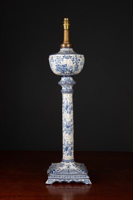 Lot 52 - An antique Dutch delftware table lamp with oil...