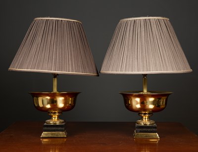 Lot 61 - A pair of gilt metal and ebonised table lamps...