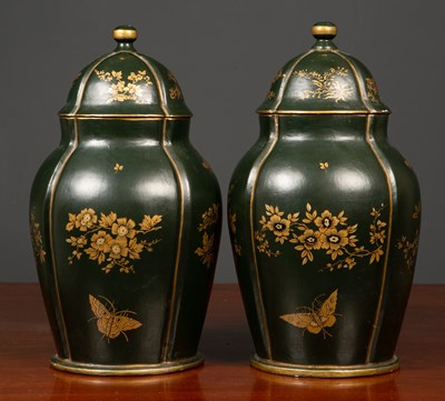 Lot 70 - A pair of dark green ground papier mache jars...