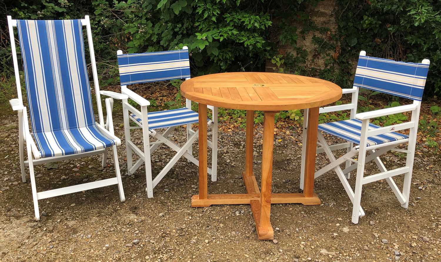 Lot 779 - A small teak circular garden table 91cm...