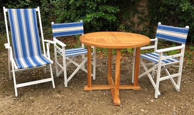 Lot 779 - A small teak circular garden table 91cm...