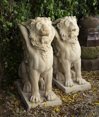 Lot 654 - A pair of cast reconstituted stone sculptures...