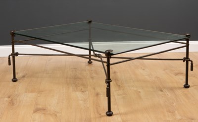 Lot 428 - A wrought iron glass topped occasional table...