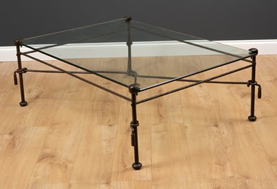 Lot 428 - A wrought iron glass topped occasional table...