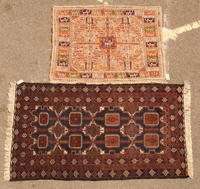 Lot 319 - An unusual cream ground hand woven woollen rug...