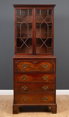 Lot 104 - A George III mahogany secretaire bookcase of...