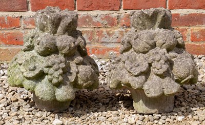 Lot 785 - A pair of cast reconstituted stone fruit and...