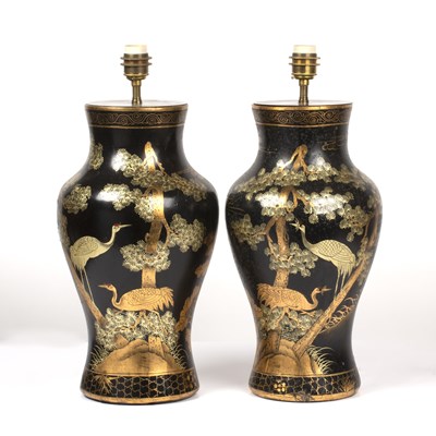 Lot 474 - A pair of black lacquered papier-mache table...