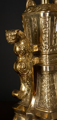 Lot 464 - A brass Chinese style table lamps of archaic...