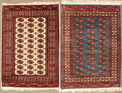 Lot 528 - A modern blue ground Baluchi rug with three...