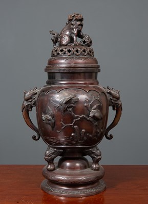 Lot 495 - A Japanese bronze temple vase and cover, the...